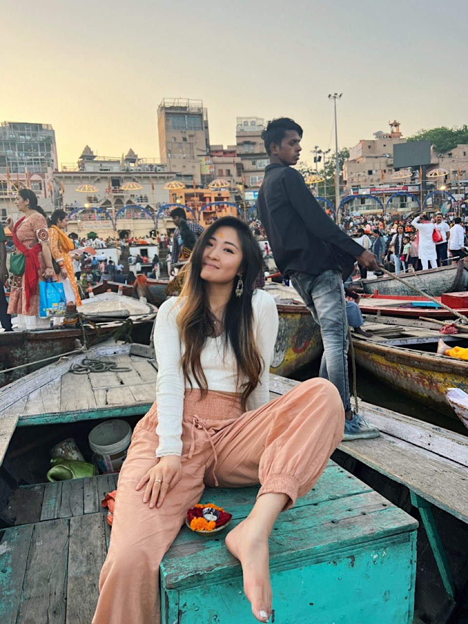 A solo female traveller enjoying a boat ride in Varanasi